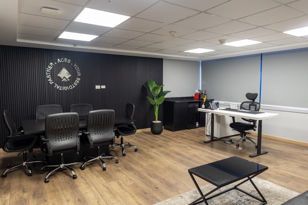 ACES executive office and meeting room with branded feature wall