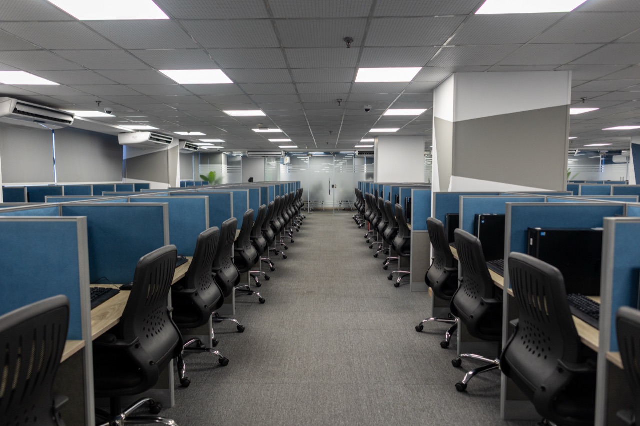 Rows of agent workstations down the center of the ACES operations floor