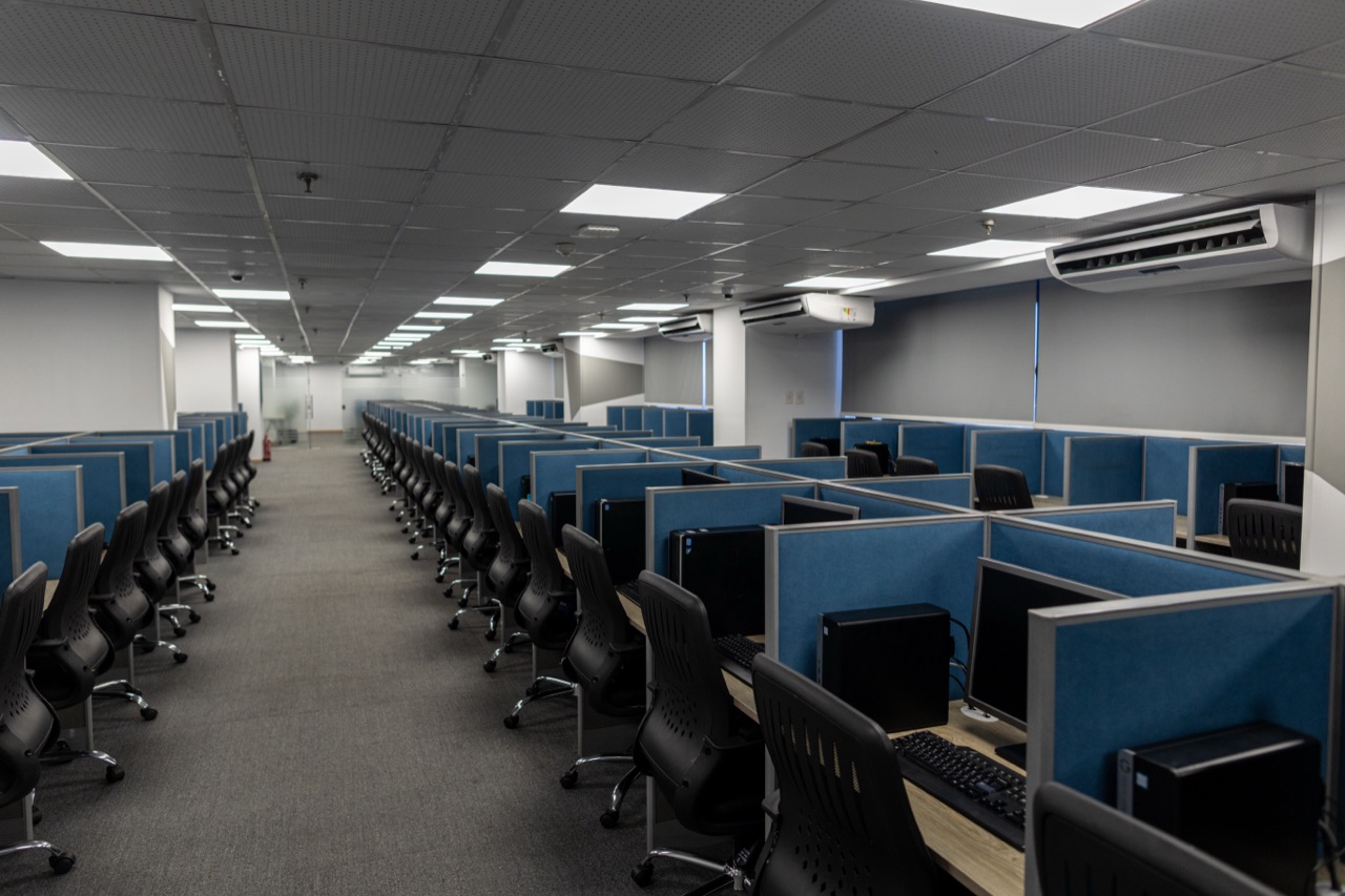 Wide view of the ACES contact center floor and workstations